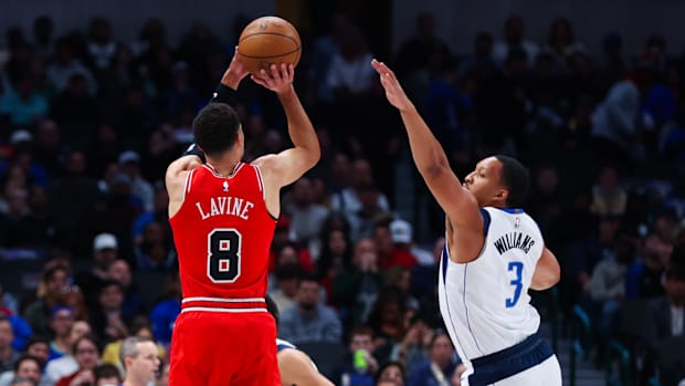 Chicago Bulls star Zach LaVine shoots over Dallas Mavericks' Grant Williams.